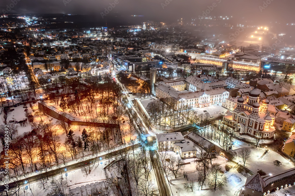 Fototapeta premium Aerial night View of Tallinn in winter with Alexander Nevsky Cathedral, roofs with snow, Christmas mood