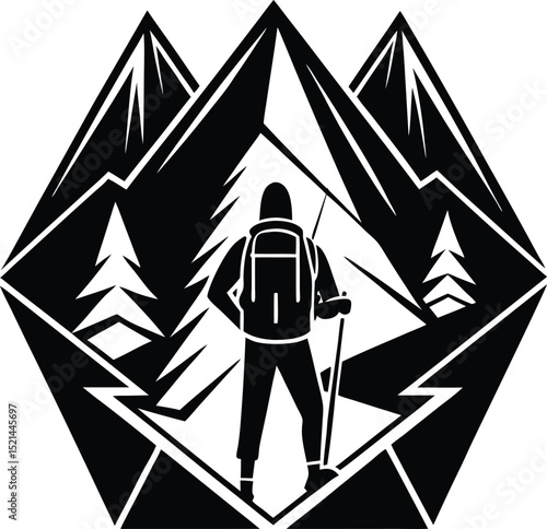Silhouetted Hiker with Backpack and Hiking Stick in a Mountain Landscape