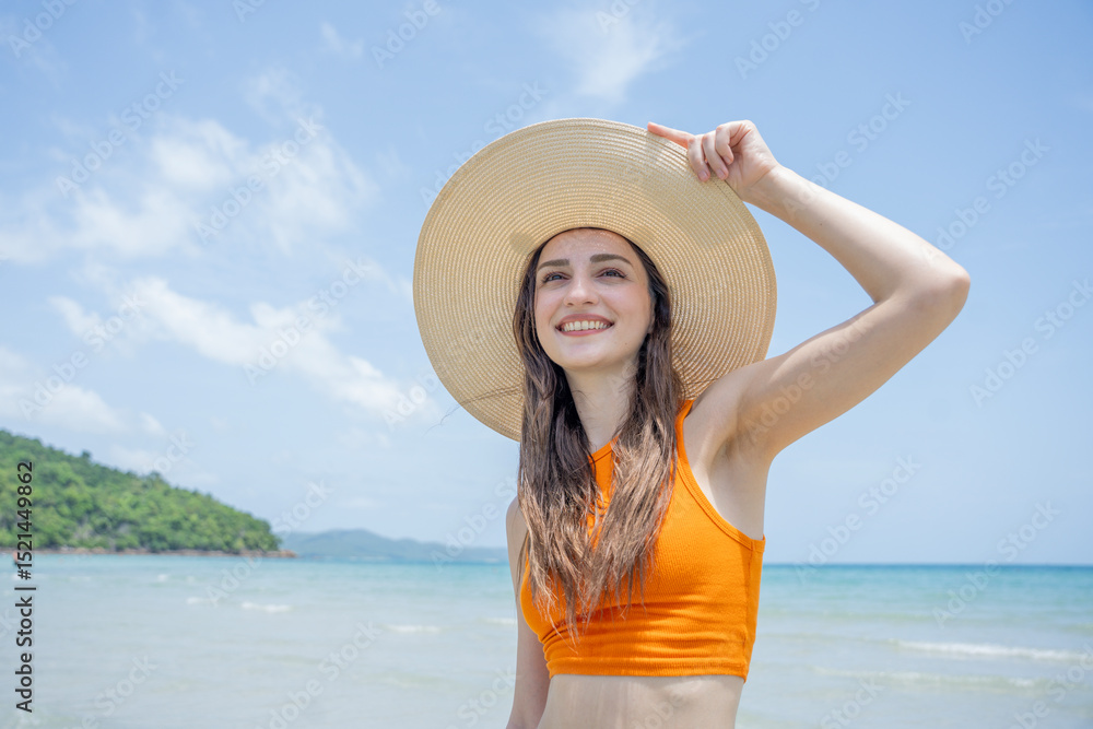 Happy beautiful young woman smiling at the beach side - Delightful girl enjoying sunny day. Summer holiday fashion concept. Young fashion woman relax on the beach. Happy beautiful young woman smiling at the beach side - Delightful girl enjoying sunny day. Summer holiday fashion concept. Young fashion woman relax on the beach.