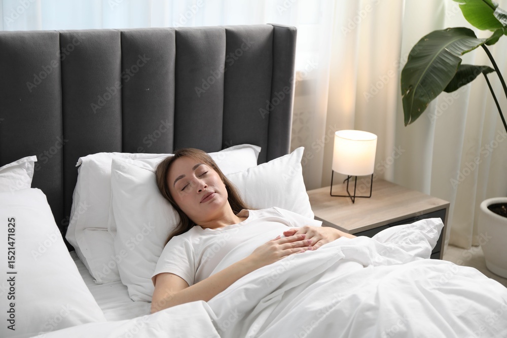 Beautiful woman sleeping in bed at home Beautiful woman sleeping in bed at home
