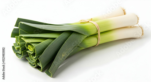 Fresh Leeks Stacked Together With A Band On A White Surface