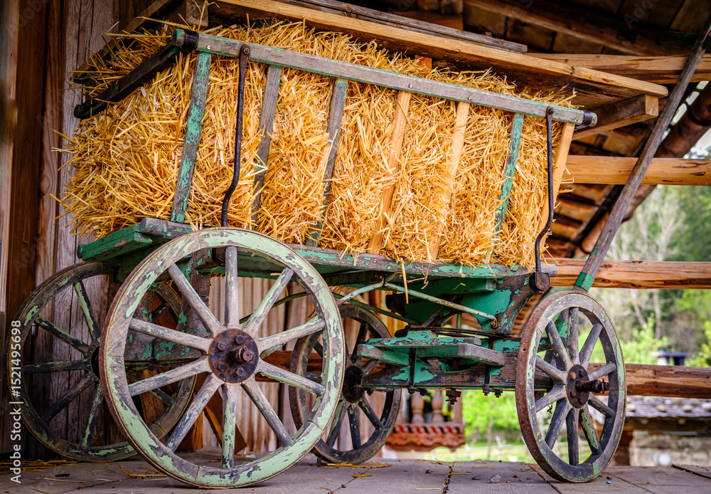 custom made wallpaper toronto digitalVintage wooden cart with large wheels resting on a dusty floor in a rustic barn environment during the late afternoon light