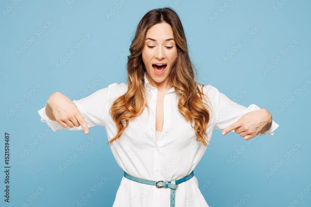 Fototapeta premium Young fun surprised employee business woman corporate lawyer wear shirt classic formal clothes work in office point index finger down on area isolated on pastel light blue background studio portrait.