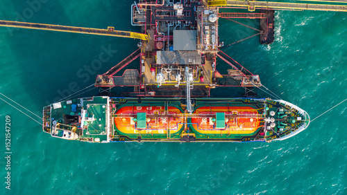 LNG (Liquified Natural Gas) tanker anchored in Gas terminal gas tanks for storage. Oil Crude Gas Tanker Ship. LPG at Tanker Bay Petroleum Chemical or Methane freighter export import transportation