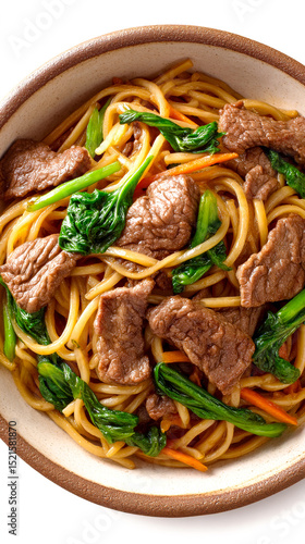 Chinese beef lo mein with fresh bok choy and shredded carrots in a ceramic bowl on a white background, top view, close-up.