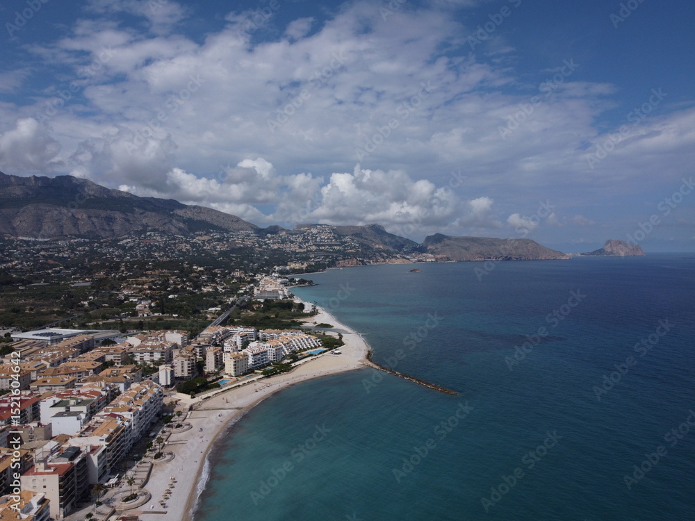 Fototapeta premium View of Costa Blanca from the sea near Altea, showing the blend of coastal townscape, white buildings, and the Mediterranean shoreline.