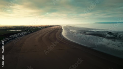 Drone shot along beach at Burnham-On-Sea, UK.