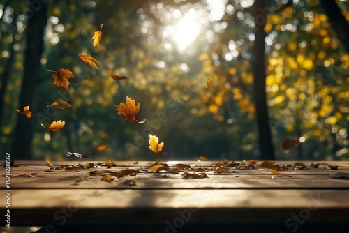Leaves Swirling Gracefully Above a Rustic Wooden Table During Autumn Sunset i...