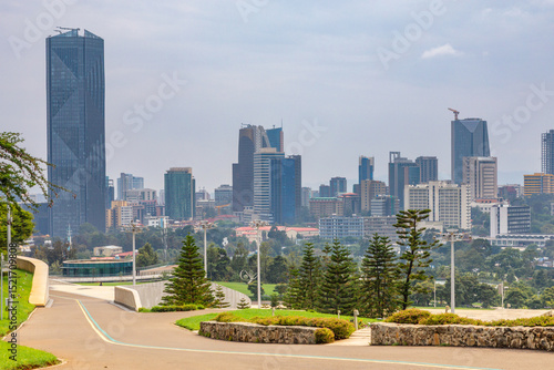 Central business district with modern skyscrapers of downtown of Addis Ababa road and green park in the foreground, Ethiopia