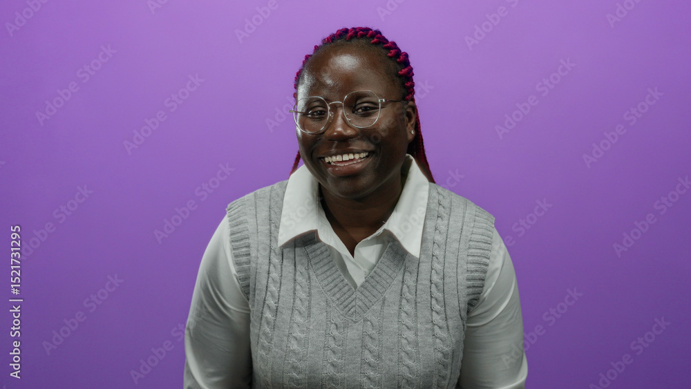 Obraz premium African american woman smiling with hands up against isolated purple background wearing glasses and grey sweater.