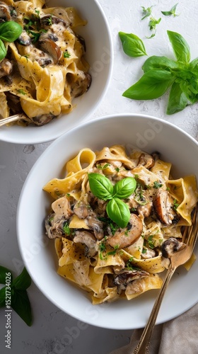 Creamy Chicken Fettuccine With Mushrooms and Fresh Basil in a Bowl on Marble ...