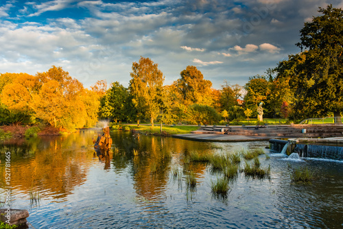 Reflection over the lake of Odense in autumn,  Denmark