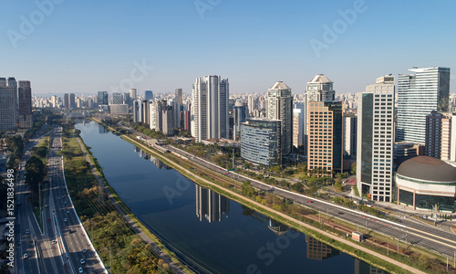 Urban cityscape with buildings along a Pinheiros river, and Marginal Pinheiros in Sao Paulo city.
