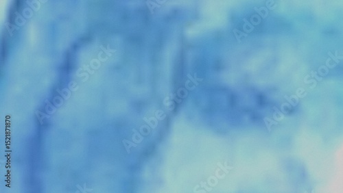 A blurry image featuring a blend of light blue and teal shades, creating a soft, abstract watercolor effect. The colors transition smoothly, lacking sharp lines or defined shapes.
