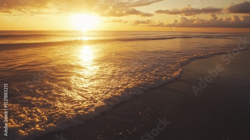 Golden Sunset at Seaside: The radiant sun casts its golden glow over the serene ocean, as gentle waves caress the sandy shoreline in a picturesque scene of tranquility.