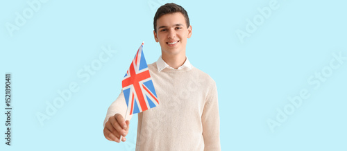 Teenage boy with UK flag on...
