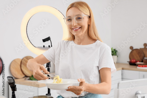 Female food blogger putting...