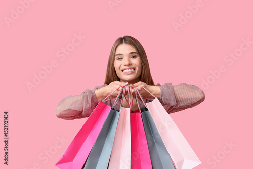 Happy young woman with shop...