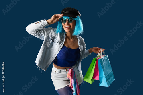 Happy young woman with blue...