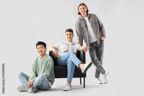 Group of young men with arm...