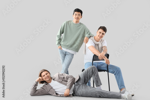 Group of young men on light...