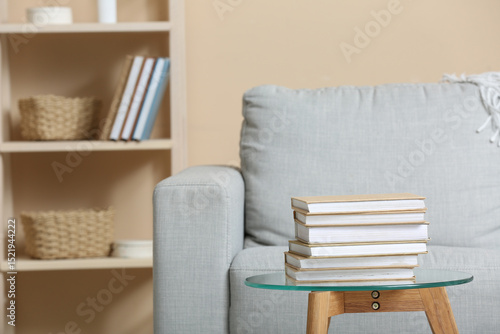 Stack of books on a glass c...