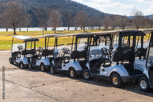Golf carts lined up at a golf course in Oil City, Pennsylvania, USA on a sunny winter day