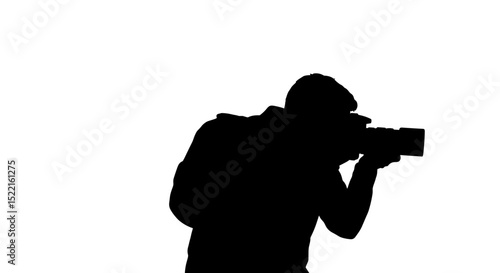 Silhouette of photographer aiming camera against a white background  