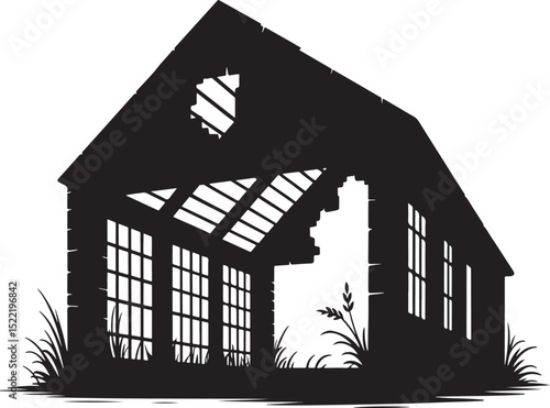 Silhouette of a ruined old barn overgrown with grass.