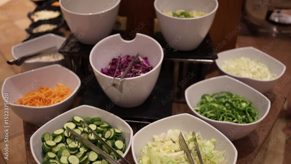 Fresh salad bar with sliced cucumbers shredded carrots crisp lettuce and colorful peppers in modern white bowls offers healthy vibrant choices perfect for hotel breakfasts or lunch buffets Fresh salad bar with sliced cucumbers shredded carrots crisp lettuce and colorful peppers in modern white bowls offers healthy vibrant choices perfect for hotel breakfasts or lunch buffets
