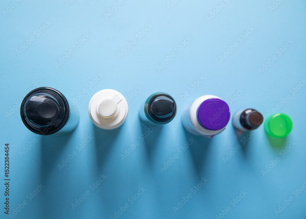 Hair loss foams on the blue background. Hair loss foams on the blue background.