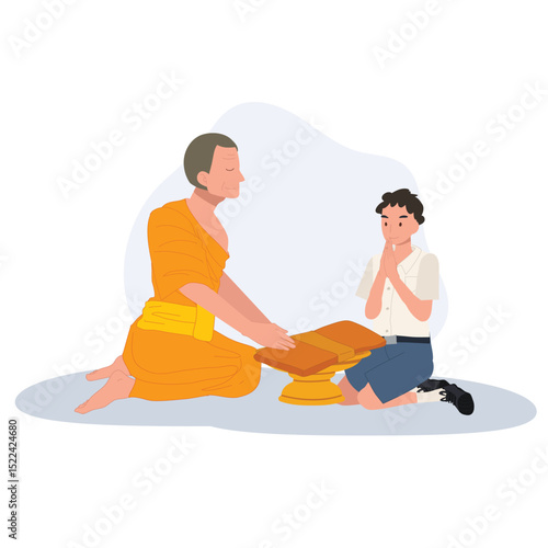 A Thai student boy offers a bathing robe to a monk during Buddhist Lent
