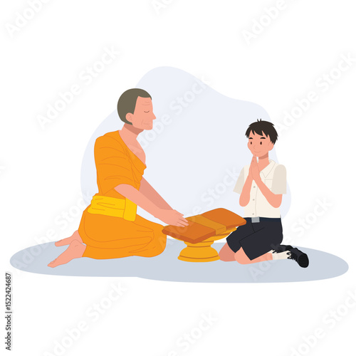 A Thai student boy offers a bathing robe to a monk during Buddhist Lent