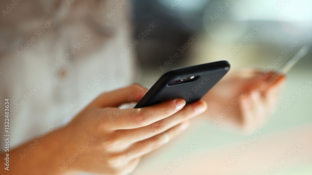 Person, hands or phone with credit card for online shopping, payment or banking app in city. Closeup, shopper or ecommerce with mobile smartphone or debit for remote transaction in urban area Person, hands or phone with credit card for online shopping, payment or banking app in city. Closeup, shopper or ecommerce with mobile smartphone or debit for remote transaction in urban area