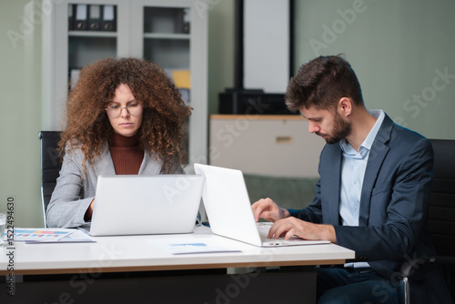 Wallpaper Mural Diverse professionals collaborate on project analysis with financial graphs. Strategic teamwork and insights drive company growth and success. Torontodigital.ca