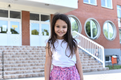 Portrait of a little smiling 8-year-old girl