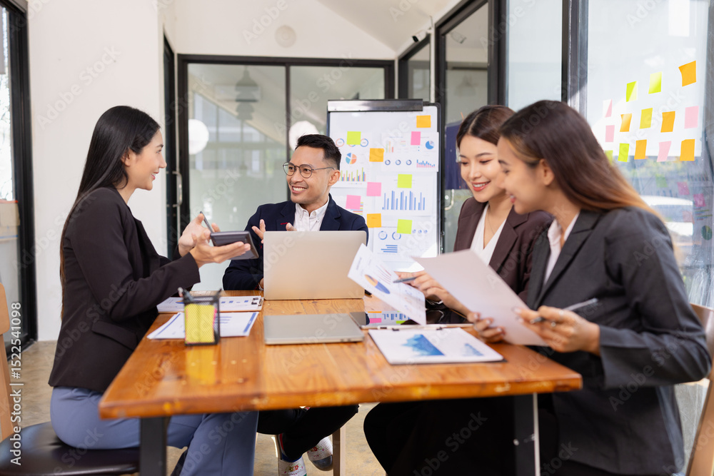 Group of business people working together with dashboard analysis and data management a meeting table in office. Group of business people working together with dashboard analysis and data management a meeting table in office.