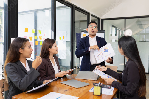 Group of business people working together with dashboard analysis and data management a meeting table in office.