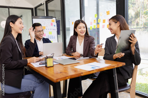 Group of Asian business working plan analysis project brainstorm in modern office, Asian businesspeople team working together, Business startup and company strategy planning concept.
