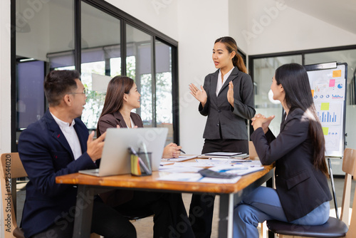 Group of Asian business working with analysis project brainstorm in modern office, Asian businesspeople team working together, Business startup and company strategy planning concept.