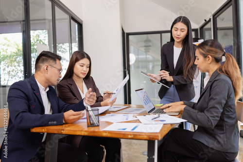 Group of Asian business working with analysis project brainstorm in modern office, Asian businesspeople team working together, Business startup and company strategy planning concept.