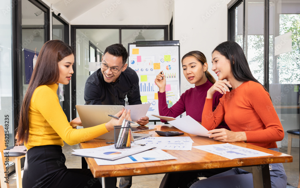 Fototapeta premium Group of Asian business working analysis project brainstorm in modern office, Asian businesspeople team working together, Business startup and company strategy planning concept.