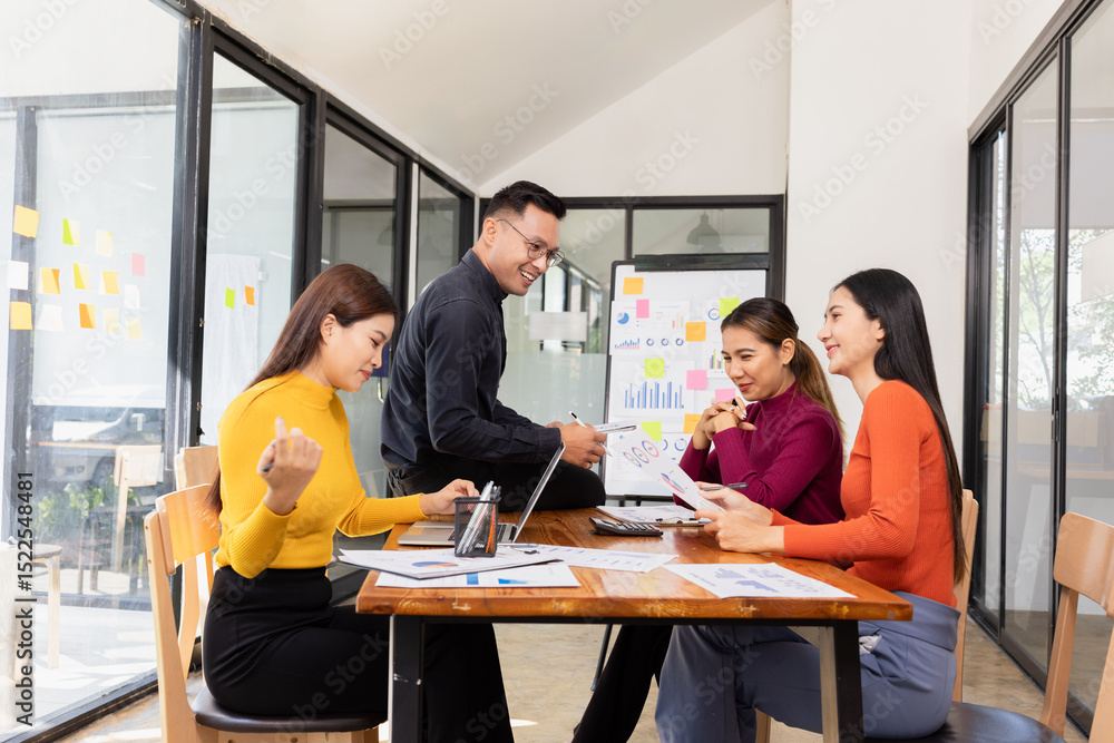 Obraz premium Group of Asian business working analysis project brainstorm in modern office, Asian businesspeople team working together, Business startup and company strategy planning concept.