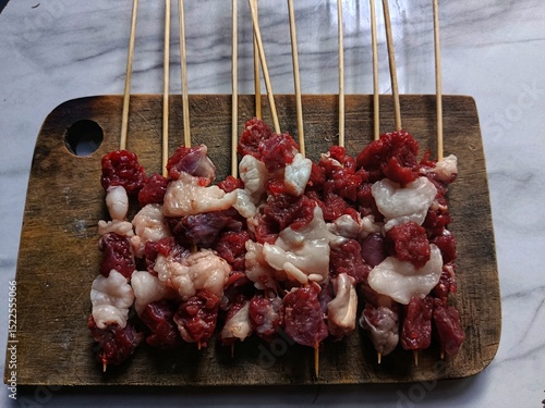 Raw satay made from goat meat, ready to be grilled