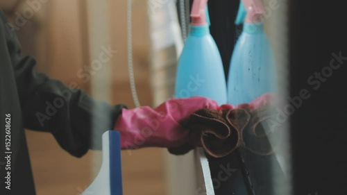 Wallpaper Mural Person cleaning the room, cleaning staff is using cloth and spraying disinfectant to wipe the tables in the company office room. Cleaning staff. Maintaining cleanliness in the organization. Torontodigital.ca