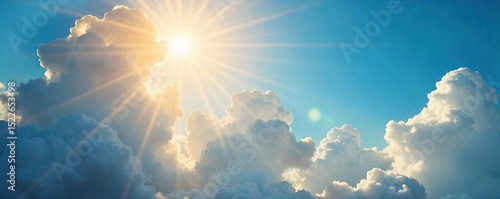 Golden sunbeams pierce through gaps in fluffy white clouds, illuminating a vibrant blue sky A breathtaking display of natural light and atmospheric beauty , natural phenomenon, natural light