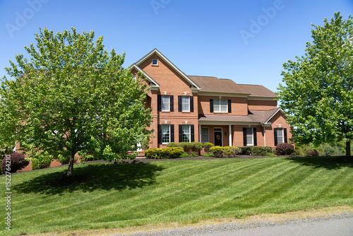 Wallpaper Mural Large, beautiful, single-family brick country house. Large lawn and green trees. Torontodigital.ca