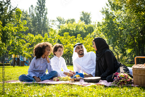 Photography cinematic image of a family from the emirates spending time at the park