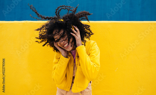 Canvas Print Young happy woman dancing and having fun outdoor.