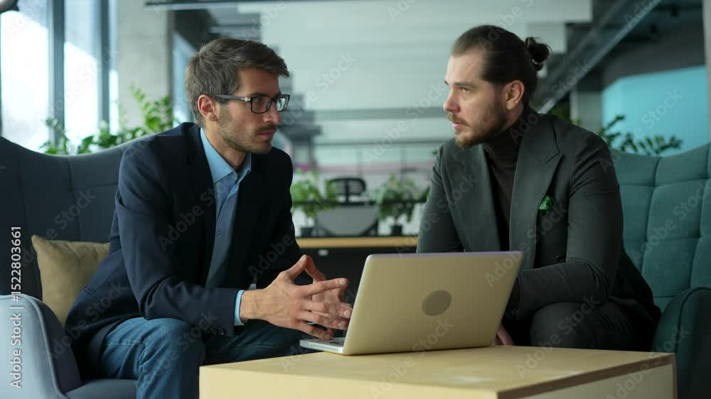 Business men discussing financial market data using laptop. Financial advisor broker manager consulting investor client about digital investment at office meeting. Business men discussing financial market data using laptop. Financial advisor broker manager consulting investor client about digital investment at office meeting.